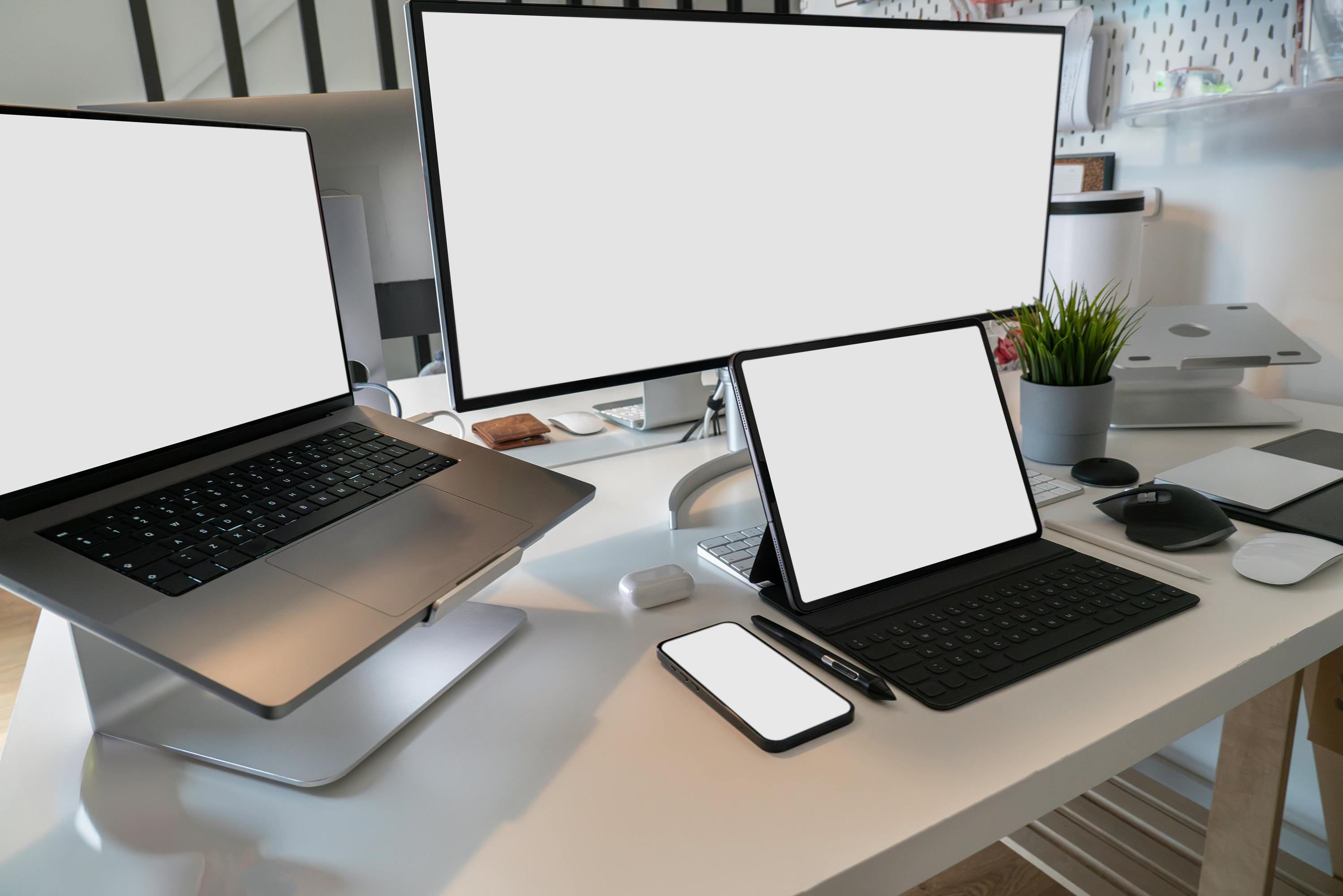 Developer working at a desktop setup with multiple screens